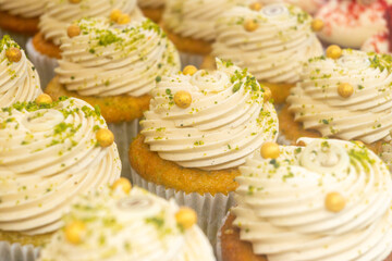 Sweet dessert fresh baked meringue cup cakes in bakery