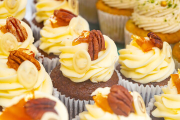 Sweet dessert fresh baked meringue cup cakes in bakery