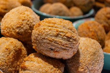 Traditional street food in UK, stuffed fried Scotch eggs with breadcrumbs close up