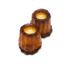 French cannele sweets on a white background
