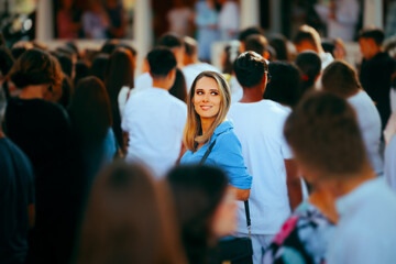 Smiling Woman in a Crowded Place Standing Out. Special individual being unique in her community opt people 
