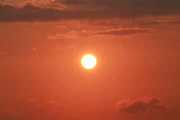 Sunrise on a sunny day with orange sky clouds