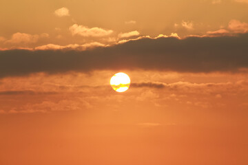 Sunrise on a sunny day with orange sky clouds