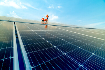 engineer man inspects construction of solar cell panel or photovoltaic cell by electronic device....
