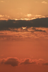 Close up view of sun hidden behind clouds photography