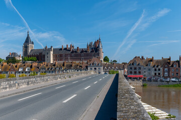 Obraz premium Views of old part of town of Gien is on the Loire river, in Loiret department, France, bridge and castle