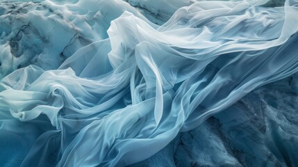 Obraz premium The incredible contrast of a flowing fabric against the solid ageold surface of a glacier.