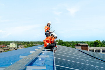 engineer man inspects construction of solar cell panel or photovoltaic cell by electronic device....