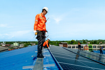 engineer man inspects construction of solar cell panel or photovoltaic cell by electronic device....
