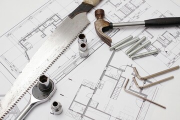 House build tool set on drawing background.