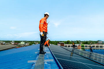 engineer man inspects construction of solar cell panel or photovoltaic cell by electronic device....