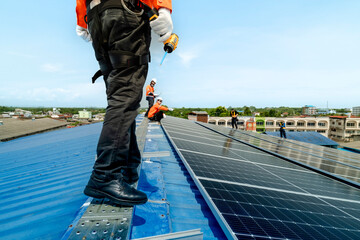 engineer man inspects construction of solar cell panel or photovoltaic cell by electronic device....