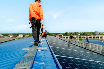 engineer man inspects construction of solar cell panel or photovoltaic cell by electronic device....