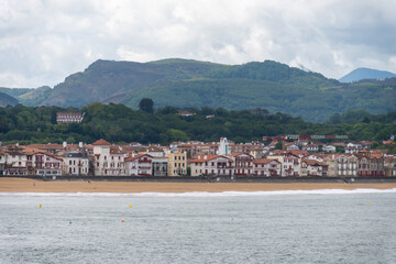 Fototapeta premium Saint-Jean-de-Luz fishing port on Basque coast, famous resort, known for beautiful architecture, sandy beaches, cuisine, South of France, Basque Country