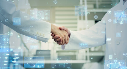 Researchers shaking hands and digital technology concept.