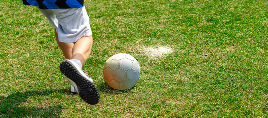 Legs of young soccer players in action on grass © JAHF