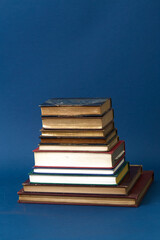 Stack of vintage books. Colorful bindings on a pile of texts. 