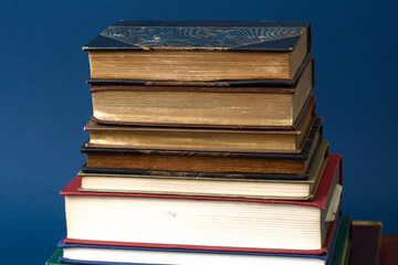 Stack of vintage books. Colorful bindings on a pile of texts. 
