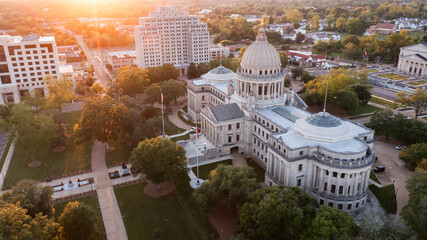 Jackson, Mississippi, USA - April 23, 2024: Sunset light shines on the historic Capitol and  buildings of downtown Jackson skyline.