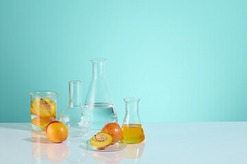 A set of lab glassware displayed on the left side of white table top, against the light blue background. Empty space for product displaying on the left side, copy space for text