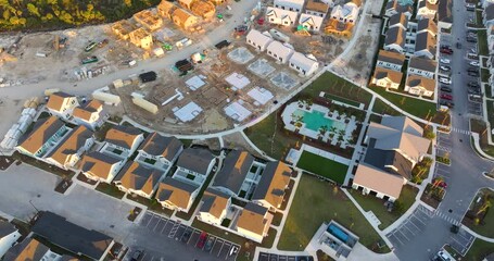 Development of residential housing in the USA. Wooden frames of new cheap American homes under construction.