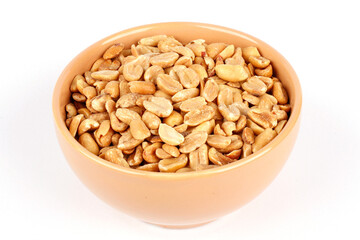 roasted peeled peanuts in ceramic bowl isolated on white background