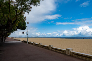 Walking on beach promenade in Arcachon, vacation destination town on Atlantic coast with beatiful...