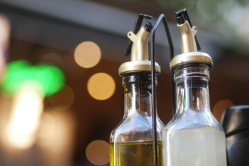 CloseUp of Olive Oil and Vinegar Dispensers in Natural Lighting, Perfect for Cooking and Seasoning