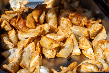 Asian food, fried in oil filled vegetarian dumplings