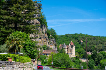 Driving along Dordogne river near   .La Roque-Gageac village located in Dordogne department in southwestern France