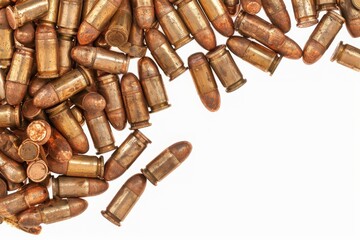 Close-up of a pile of bullets scattered on a white background, showcasing ammunition used in various firearms.