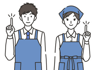 指差しポーズの店員の男性と女性