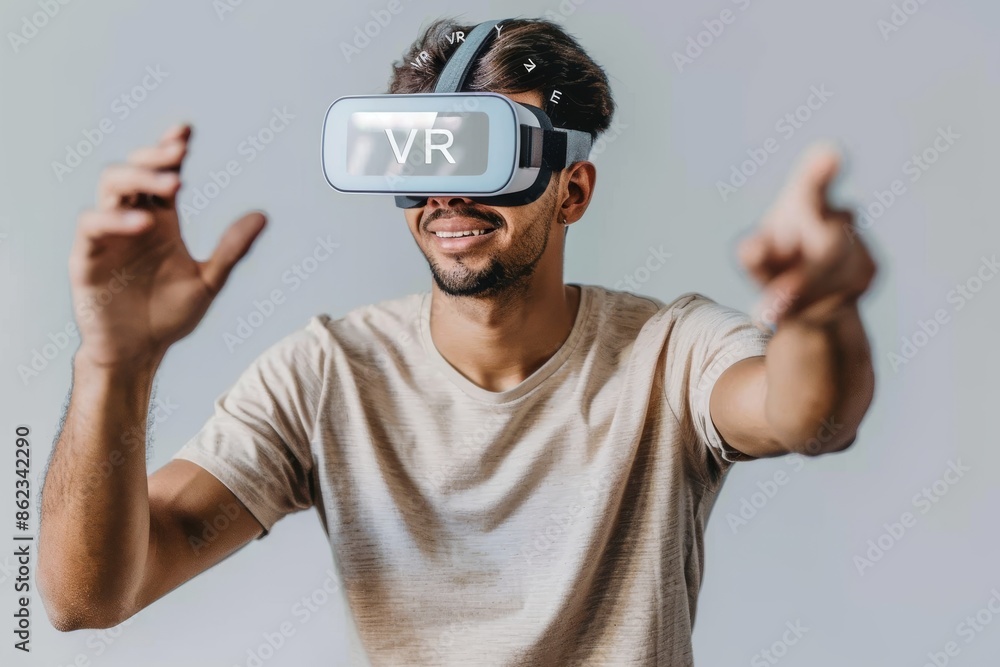 Poster Young man enjoying a VR game at home, celebrating a victory while immersed in a vibrant virtual world