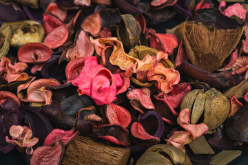 Dry aromatic potpourri leaves and petal close-up. aromatherapy dried colorful roses petals....
