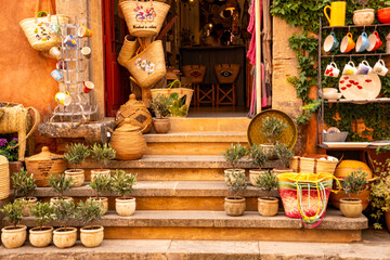 Merchandise from a souvenir shop in Roussillon in Haute-Provence region, France. Handmade wicker...
