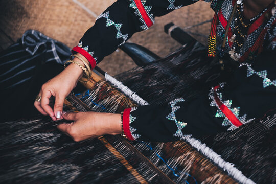 Indigenous woman AKA Dreamweaver from the south of the Philippines manually weaving the original and naturally dyed T'nalak cloth, made from quality Abaca plant fiber. Animal free native product.