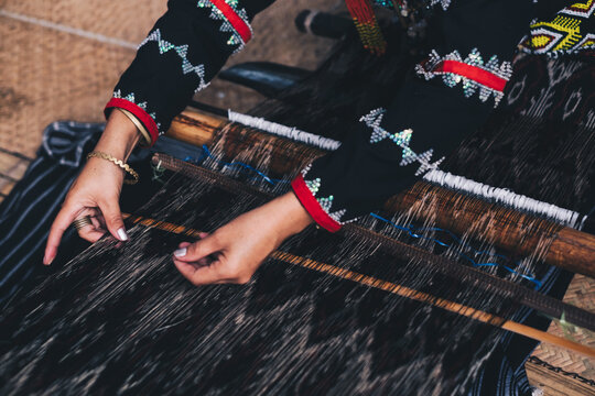 Indigenous woman AKA Dreamweaver from the south of the Philippines manually weaving the original and naturally dyed T'nalak cloth, made from quality Abaca plant fiber. Animal free native product.