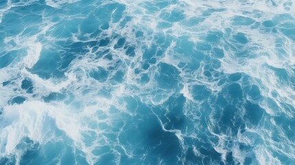 Obraz premium Beautiful aerial view of peaceful ocean waves surrounded by vibrant blue water.