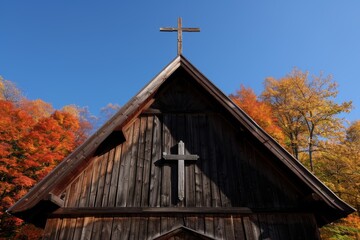 Wooden church with cross in autumn forest - Powered by Adobe