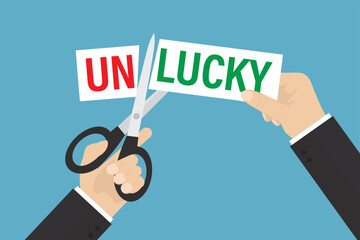 Businessman hands uses scissors cutting word UNLUCKY on paper and letters off to get LUCKY. Motivational banner, positive thinking.