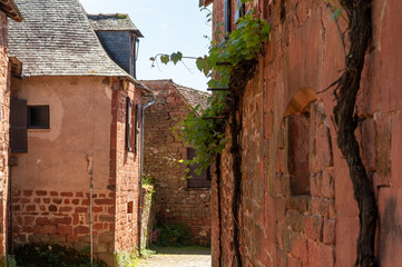 Collonges-la-Rouge village, one of the most beautiful villages in France with houses made from red stones, tourists destination in Dordogne
