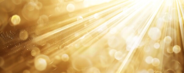 Golden abstract blurred light background with bokeh and rays of sunlight