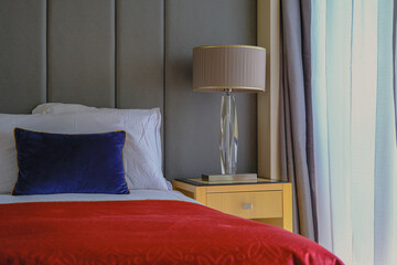 Luxurious ocean view or oceanview or outside balcony veranda cabin stateroom suite queen king double bed on luxury ocean liner cruiseship cruise ship in classic classy interior Art Deco style design