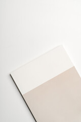 Stack of blank paper on beige background