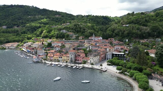 Aerial orbit of quaint Italian village of Pella on Lake Orta, Italy