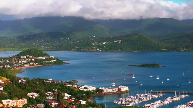 Airle Bay Beach Cannonvale aerial drone Coral Sea Marina Pioneer Bay Port heart of Great Barrier Reef Whitsundays islands Whitehaven morning mist clouds jetty sailboats yachts right motion parallax