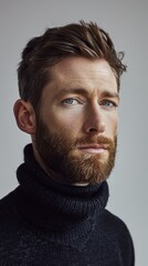 Obraz premium A close up portrait of a young man with a beard, wearing a stylish turtle neck sweater
