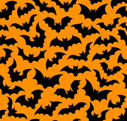 Halloween holiday flying bats seamless pattern. Vector tile background with bewitching eerie vampire bats flock silhouettes against a hauntingly vibrant orange backdrop. Scary and spooky wallpaper