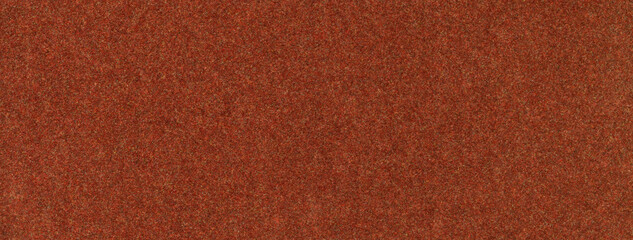Texture of dark orange color background from felt textile material, macro. Vintage ginger fabric cloth