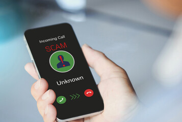 Woman holding mobile phone with incoming call from unknown caller.Scam, fraud with smartphone concept.